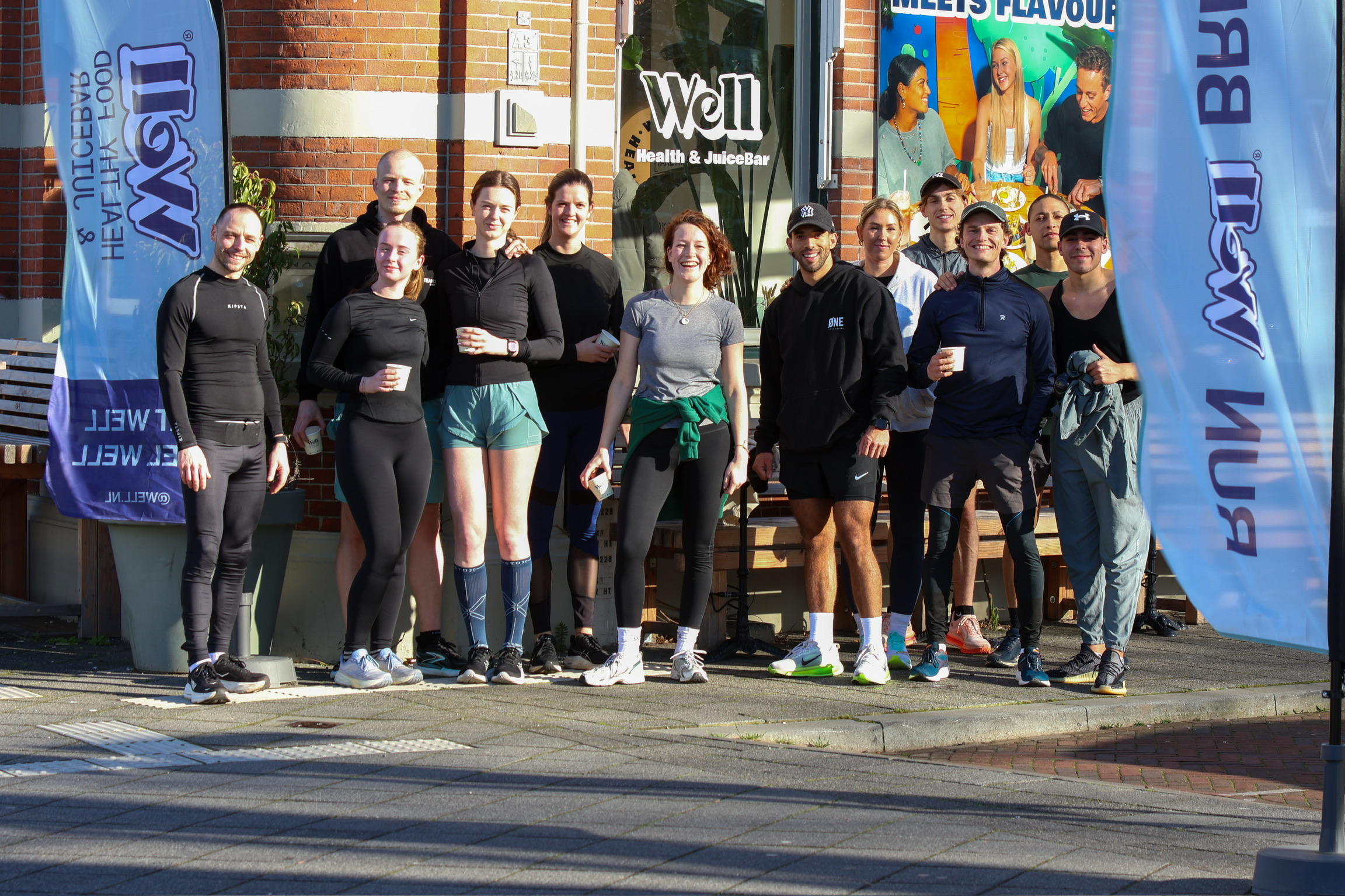 Groepsfoto van de Run Well Breda-community voor Well