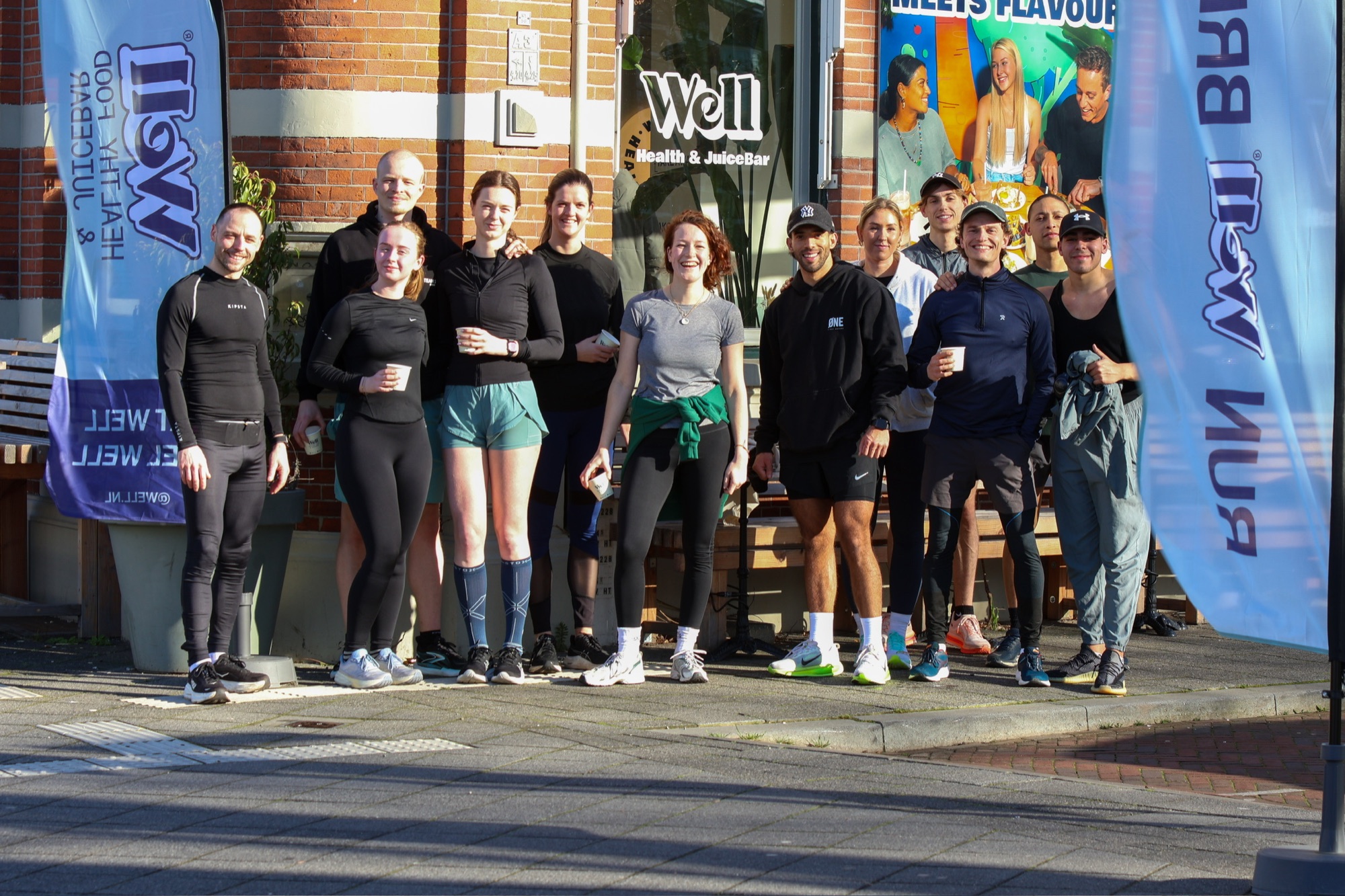 Groepsfoto van de Run Well Breda-community voor Well